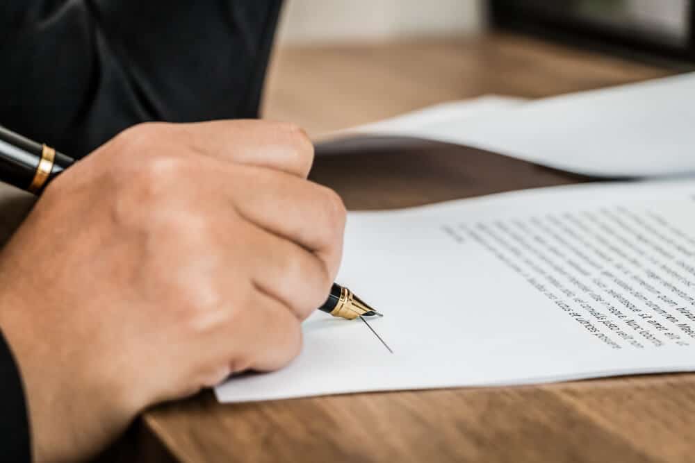 a person signing a document